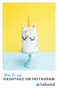 A unicorn-themed cake with a golden horn, ears, and closed eyes sits on a light blue cake stand against a yellow and blue background. Text below reads, "How to use hashtags on Instagram" with the Tailwind logo.