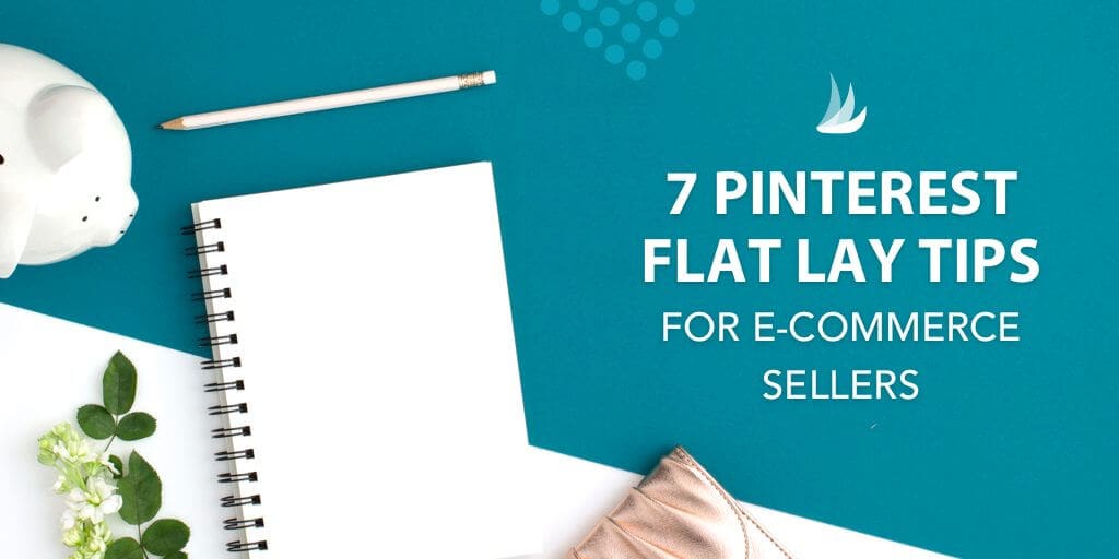 A flat lay with a white notebook, pencil, piggy bank, flower, and purse on a teal background, featuring the text: "7 Pinterest Flat Lay Tips—flat lay images for Pinterest e-commerce sellers must know.