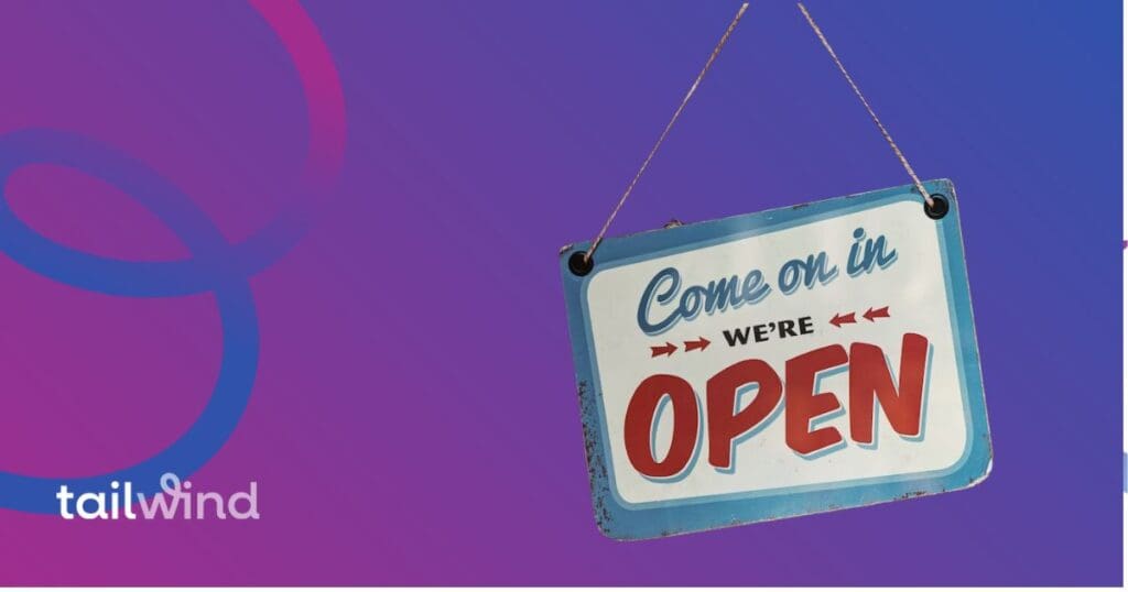 Image of a sign that says Come on In we're open on a purple background with the tailwind logo in white font.