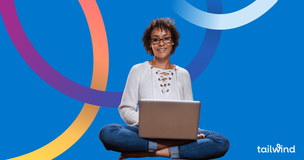 Photo of a woman sitting cross legged with a laptop on a blue background and the word Tailwind in white font.