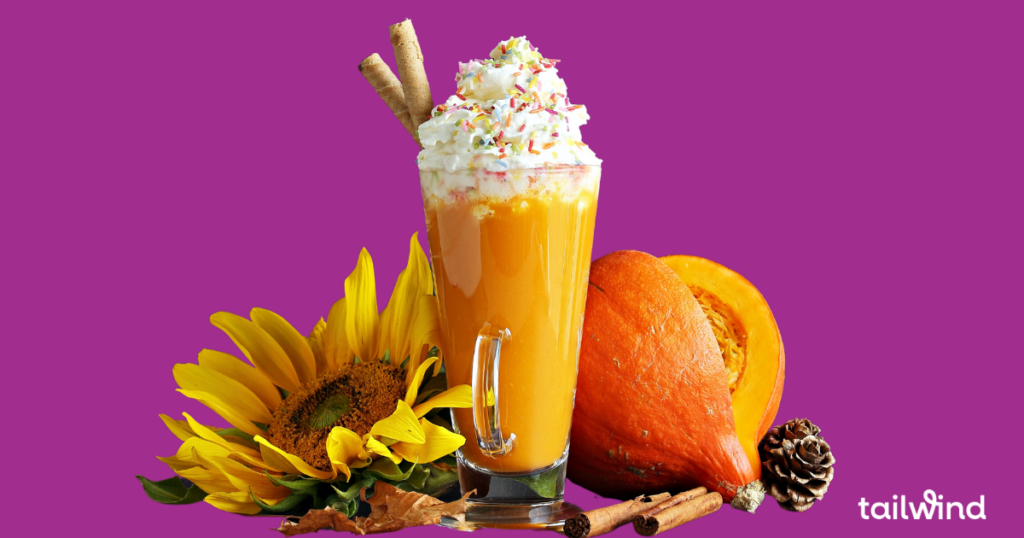 Image of a sunflower, a pumpkin, and a tall glass of an orange-colored milkshake