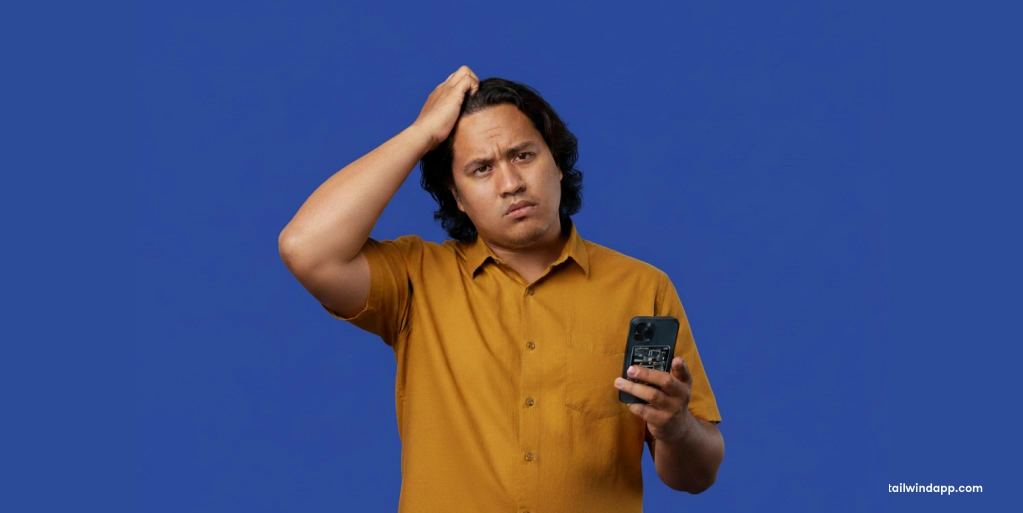 Wide banner with text 'What Counts As A Fresh Pin On Pinterest?' next to a man scratching his head in confusion while holding a phone against a solid blue background.