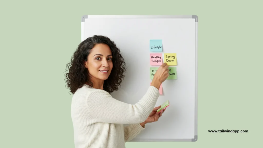 Woman organizing colorful sticky notes on a whiteboard labeled with Pinterest topics such as “Lifestyle,” “Healthy Recipes,” and “Spring Decor,” illustrating Pinterest topic clustering strategy.